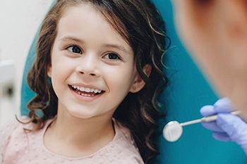 little girl smiling at the dentist