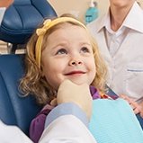 Smiling little girl in dental chair