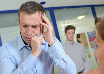 Man holding head in pain