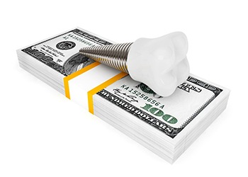 Implant on stack of money