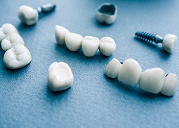 Different types of dental implants in Cumberland on blue background