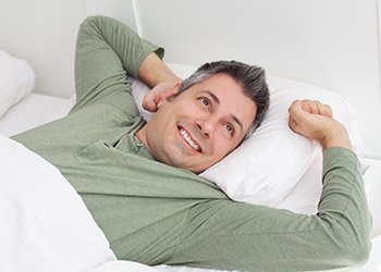 Man waking feeling refreshed