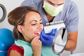 woman trying on porcelain veneers in Cumberland