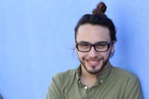 young man with a “gummy” smile before getting laser gum recontouring 